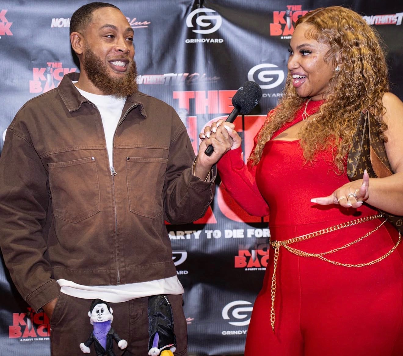 Alexus “Pretty” Johnson conducting an interview on the carpet